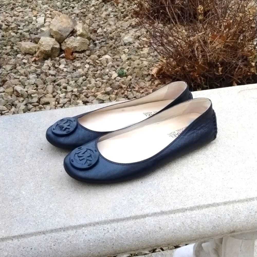 Michael Kors black leather flats with MK logo. Size 7.5
